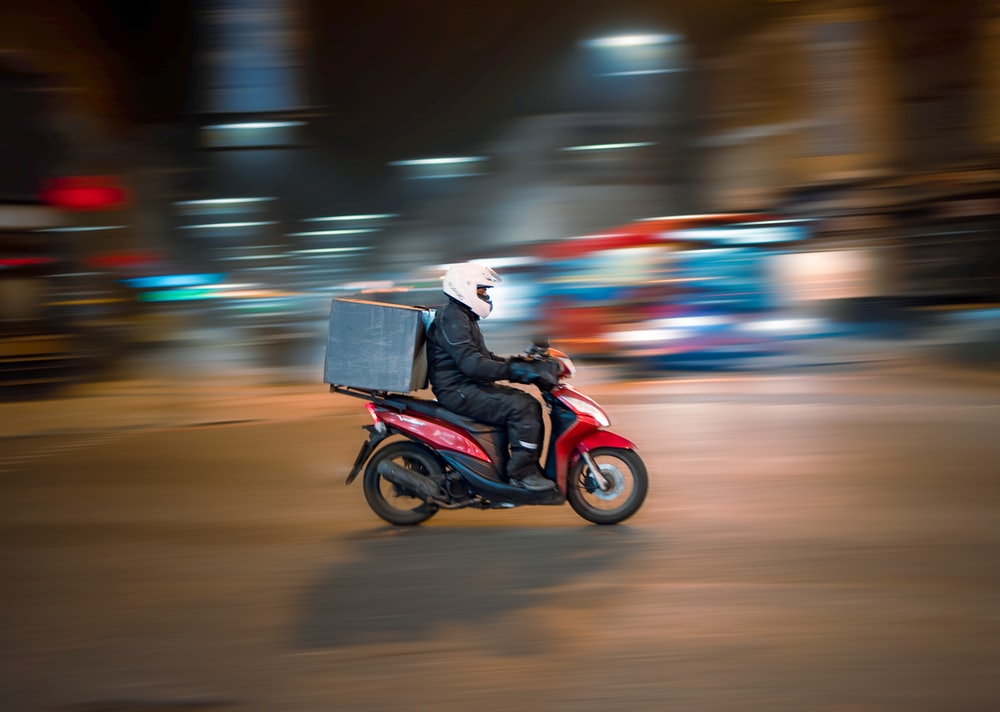 man riding motorcycle on road during daytime